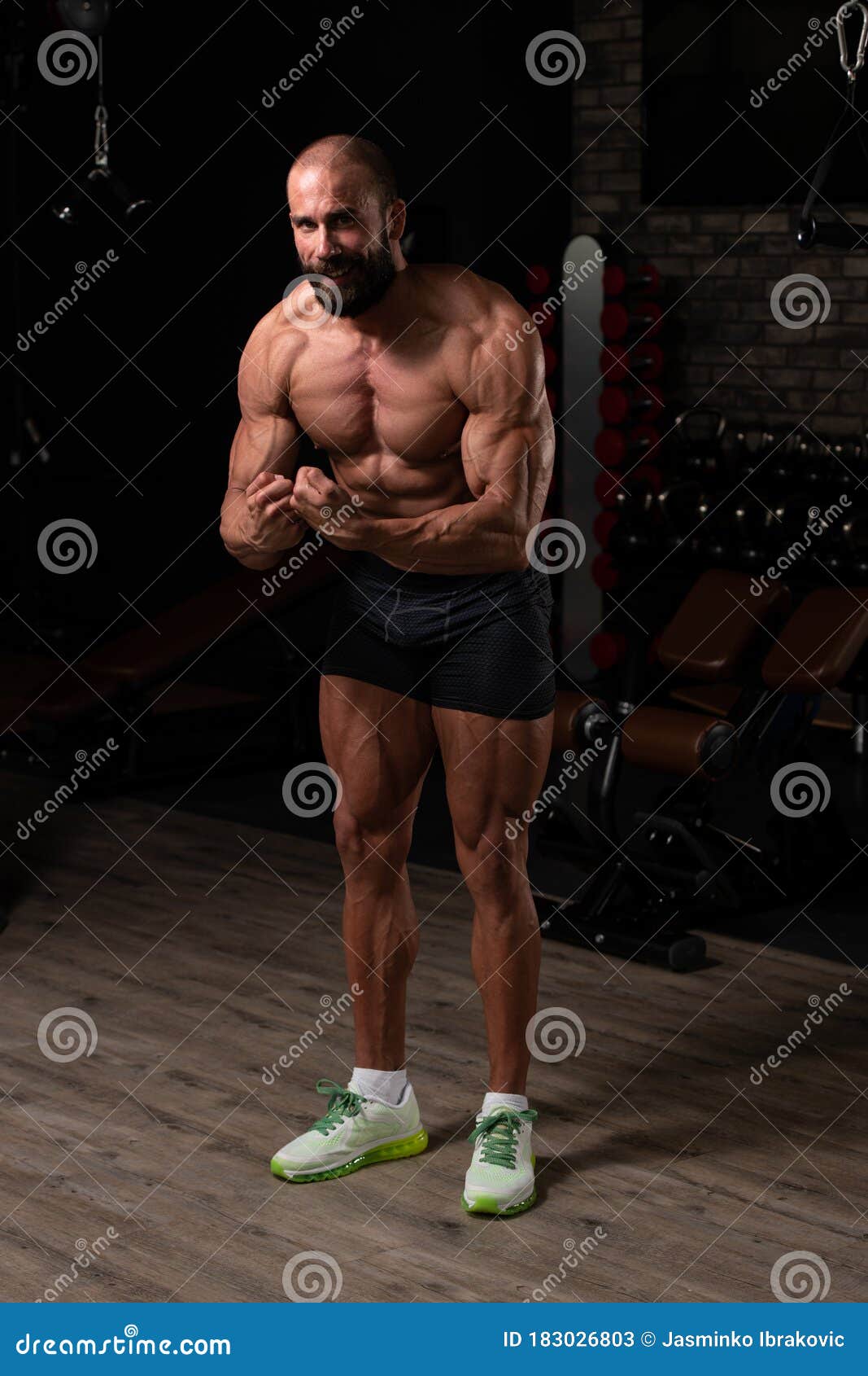 Muscular Man Flexing Muscles In Gym Stock Photo - Image of 