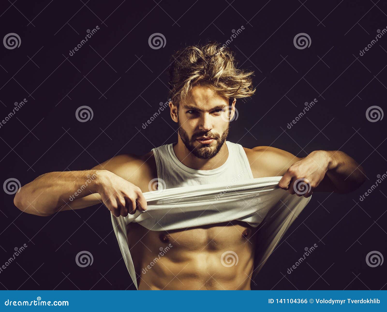 Handsome muscular man stock photo. Image of bearded - 141104366
