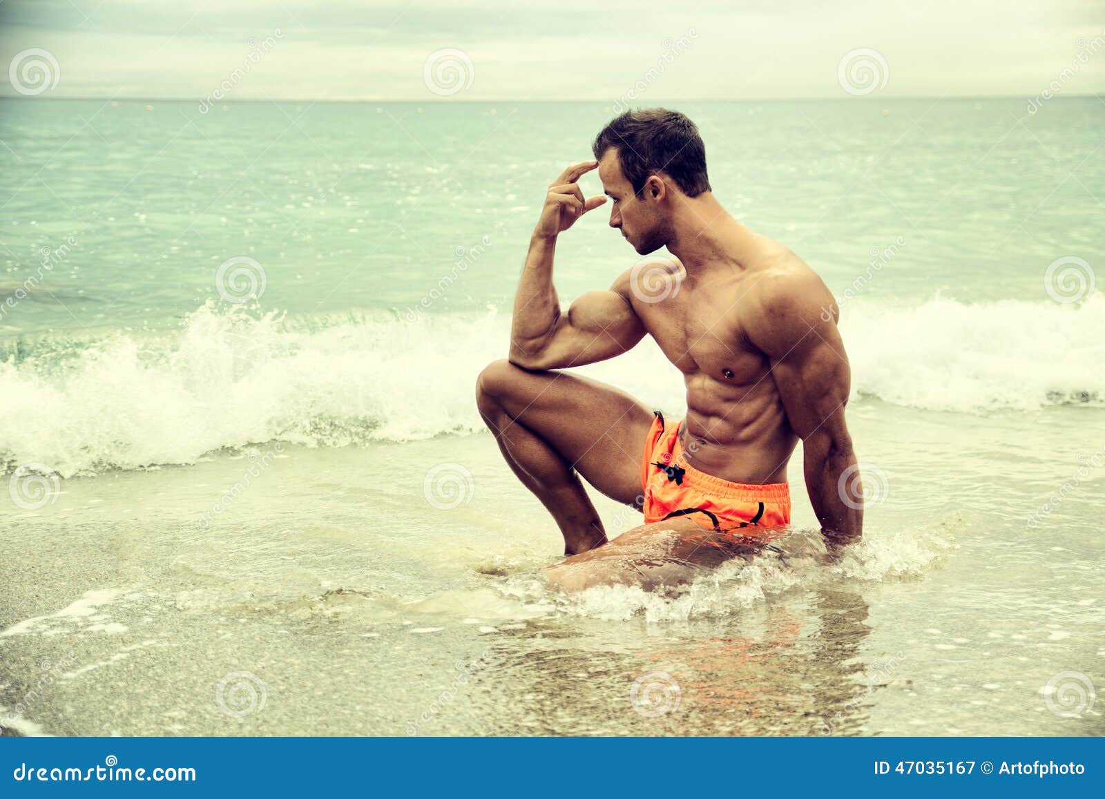Mid adult man on beach in kung fu pose, Stock Photo, Picture And Royalty  Free Image. Pic. ISO-IS09AM2NU | agefotostock