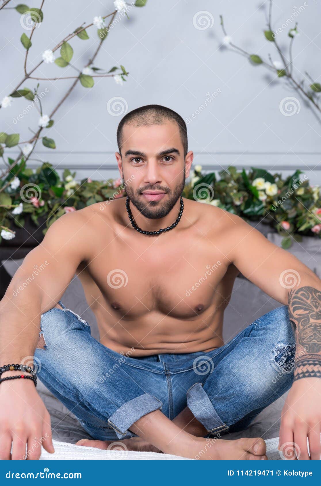 Shirtless Male Model Lying Alone On His Bed Stock Photo 