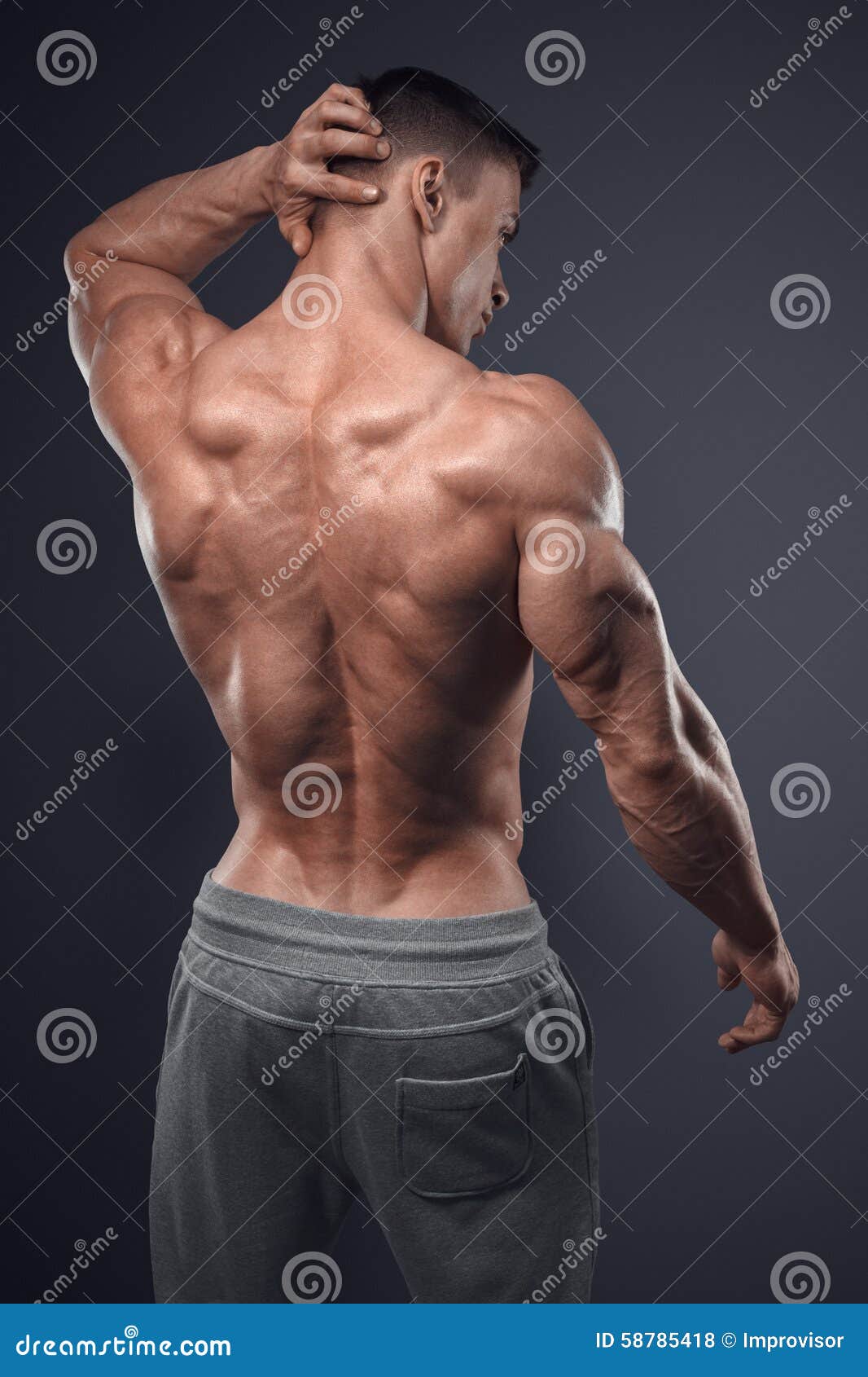 handsome power athletic man turned back