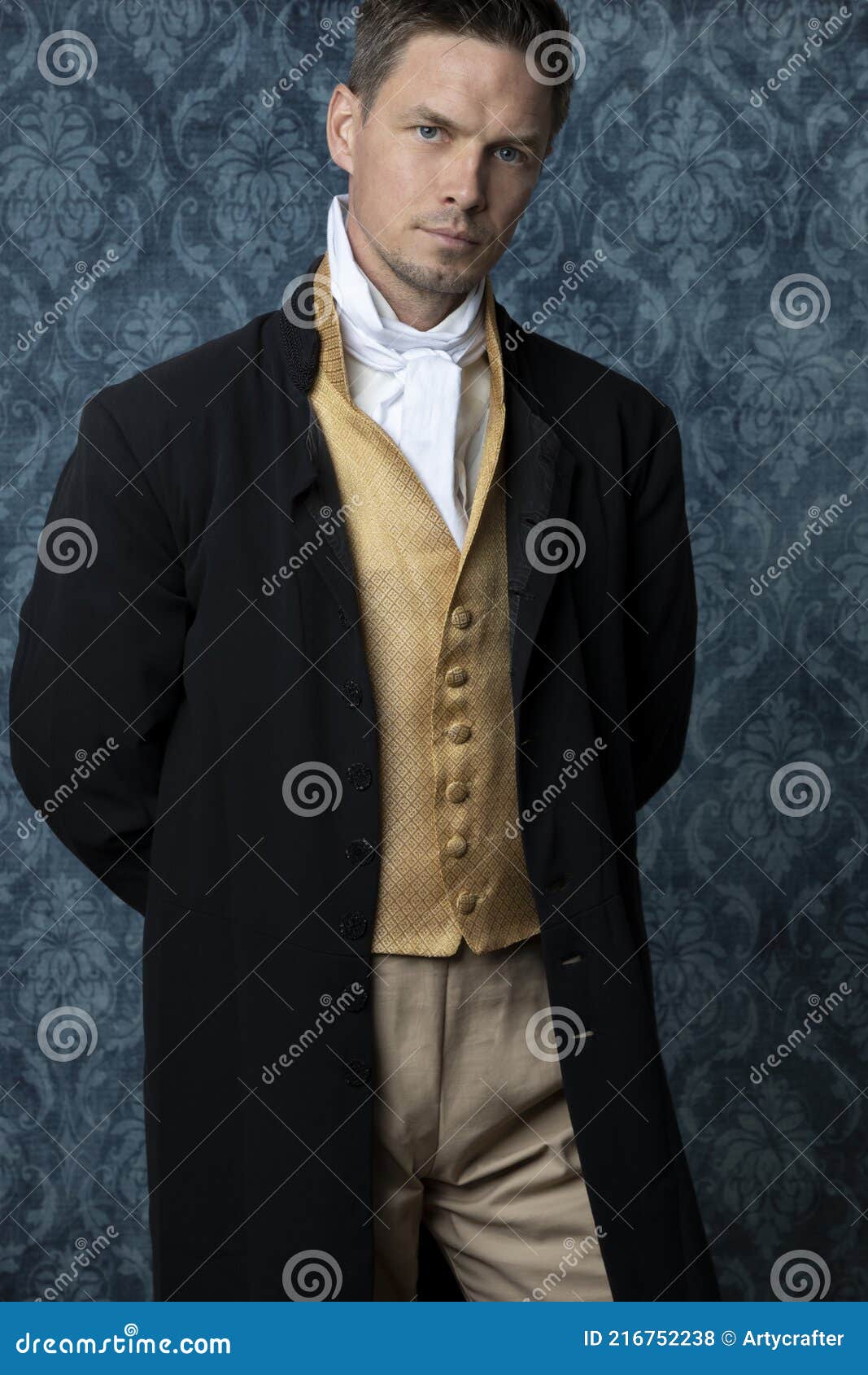 a handsome regency gentleman wearing a gold waistcoat, breeches, and a black coat