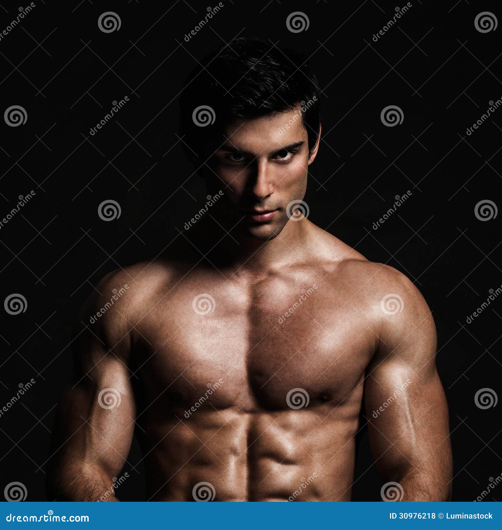 handsome shirtless model posing male studio front black background 30976218