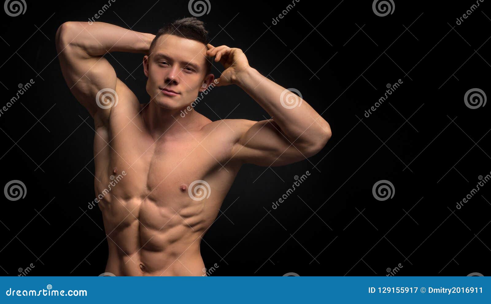 Handsome Shape Man With Muscular Body. Closeup Of Fit Young Man`s Abdomen Against Dark