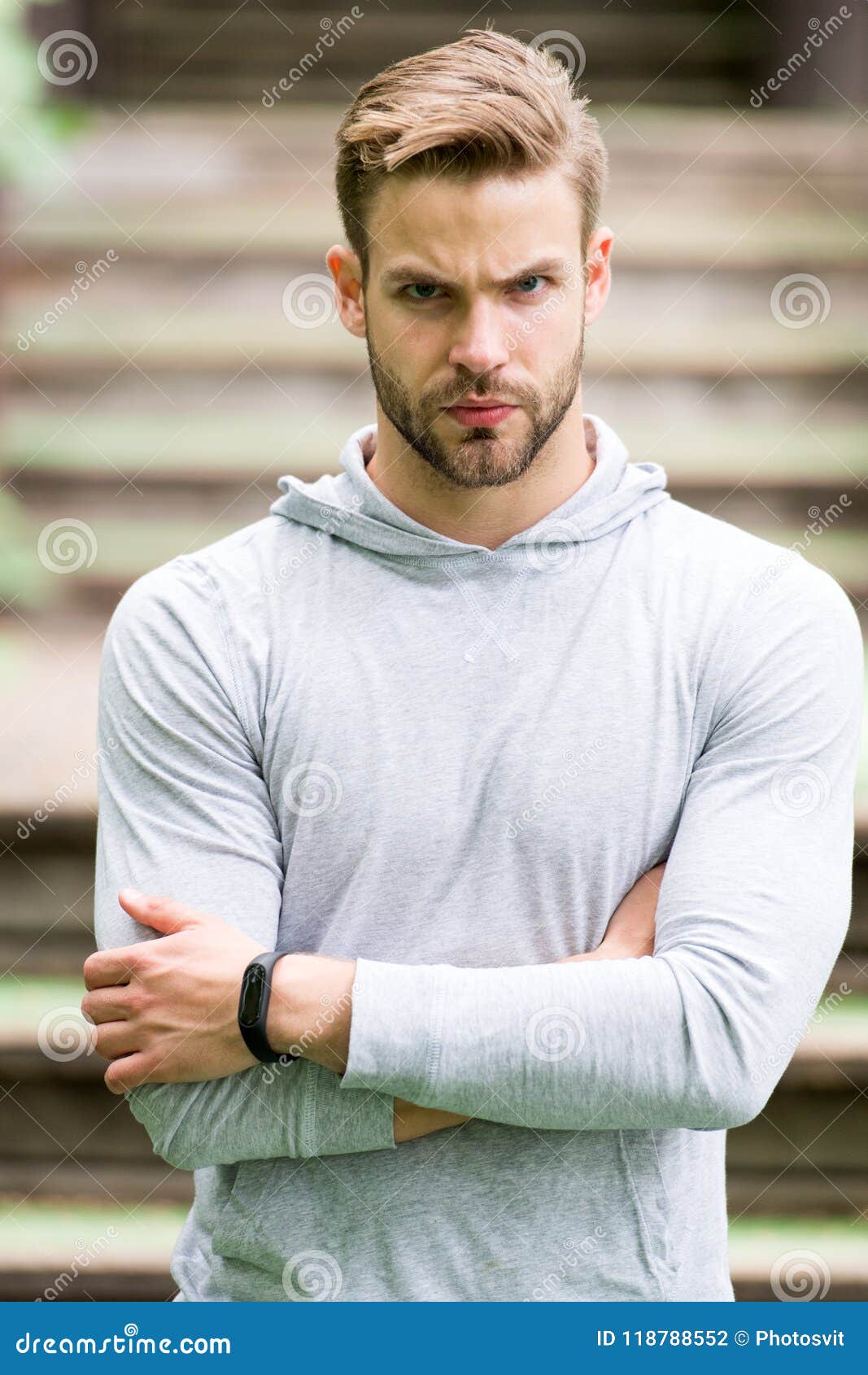 Handsome In Style Man Unshaven Folded Arms Looks Handsome And