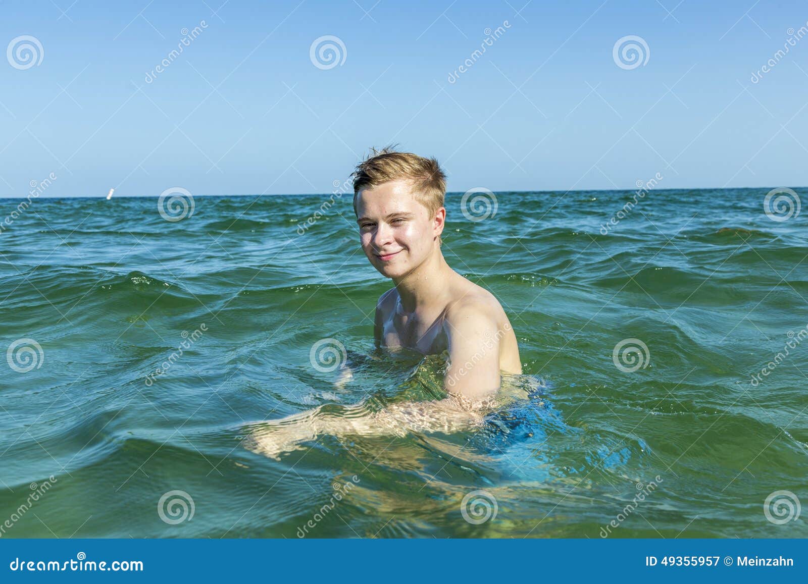 Handsome Teen Has Fun Swimming in the Ocean Stock Image - Image of ...