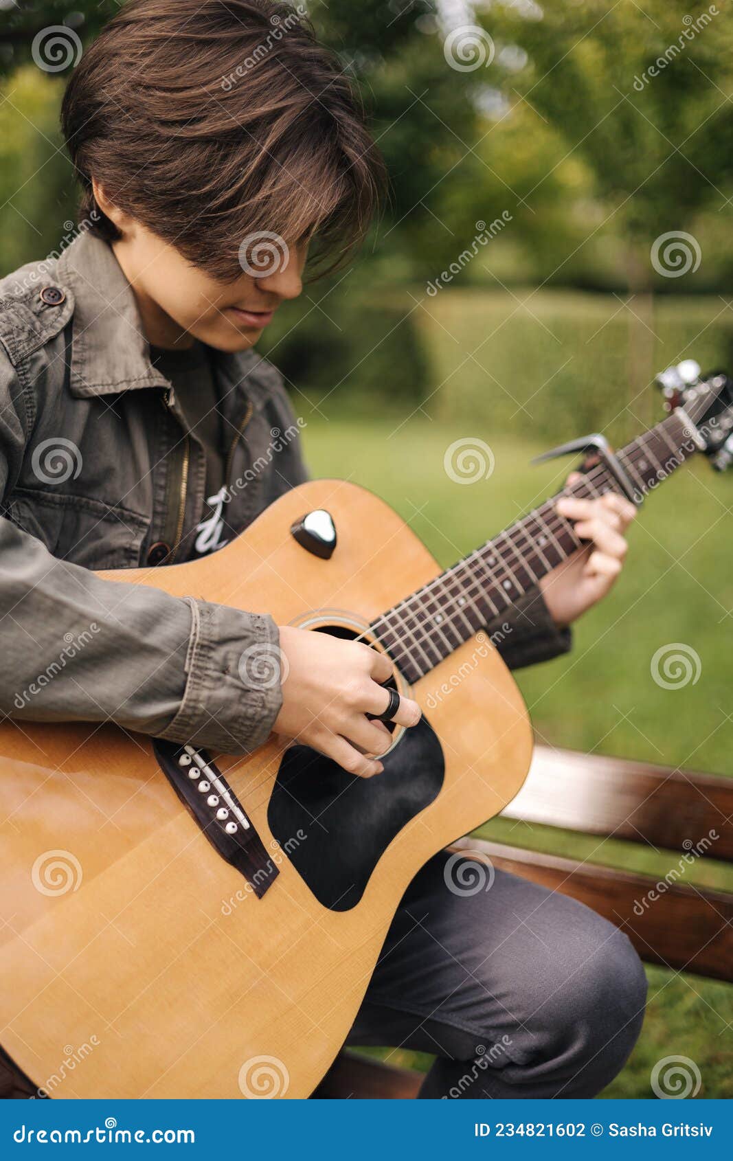 cute boy playing guitar