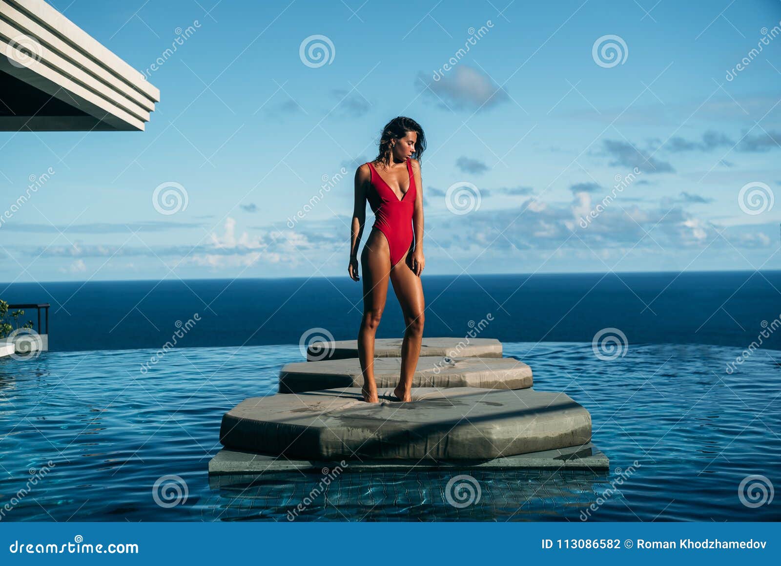 Handsome View of Girl Relaxing at Swimming Pool with Ocean at ...