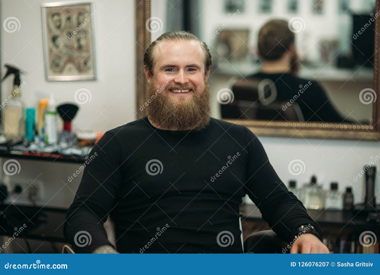 Handsome Young Bearded Guy Sitting in an Armchair in a Beauty Salon ...