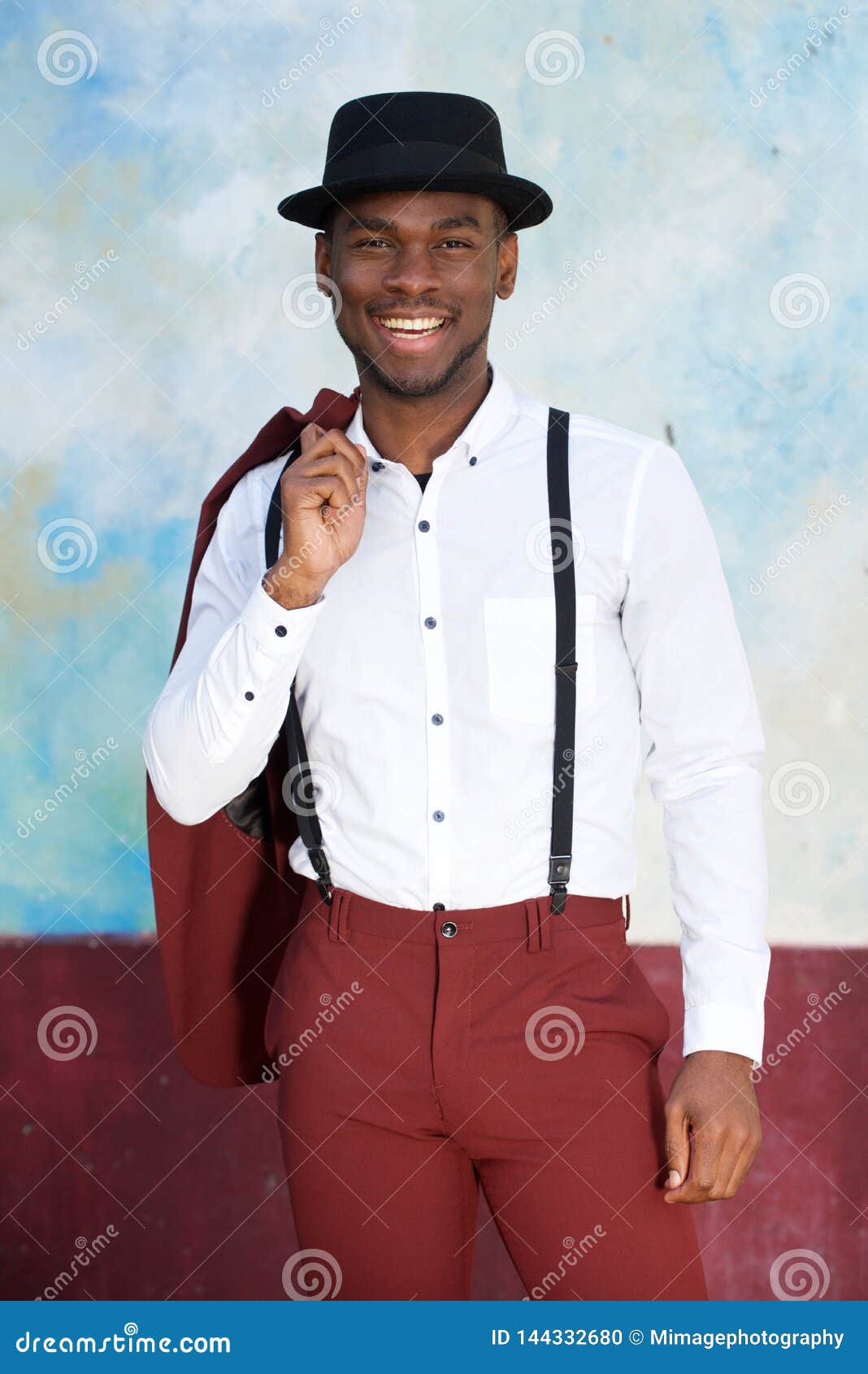 Handsome Young Black Man in Vintage Suit and Hat Smiling by Wall Stock ...