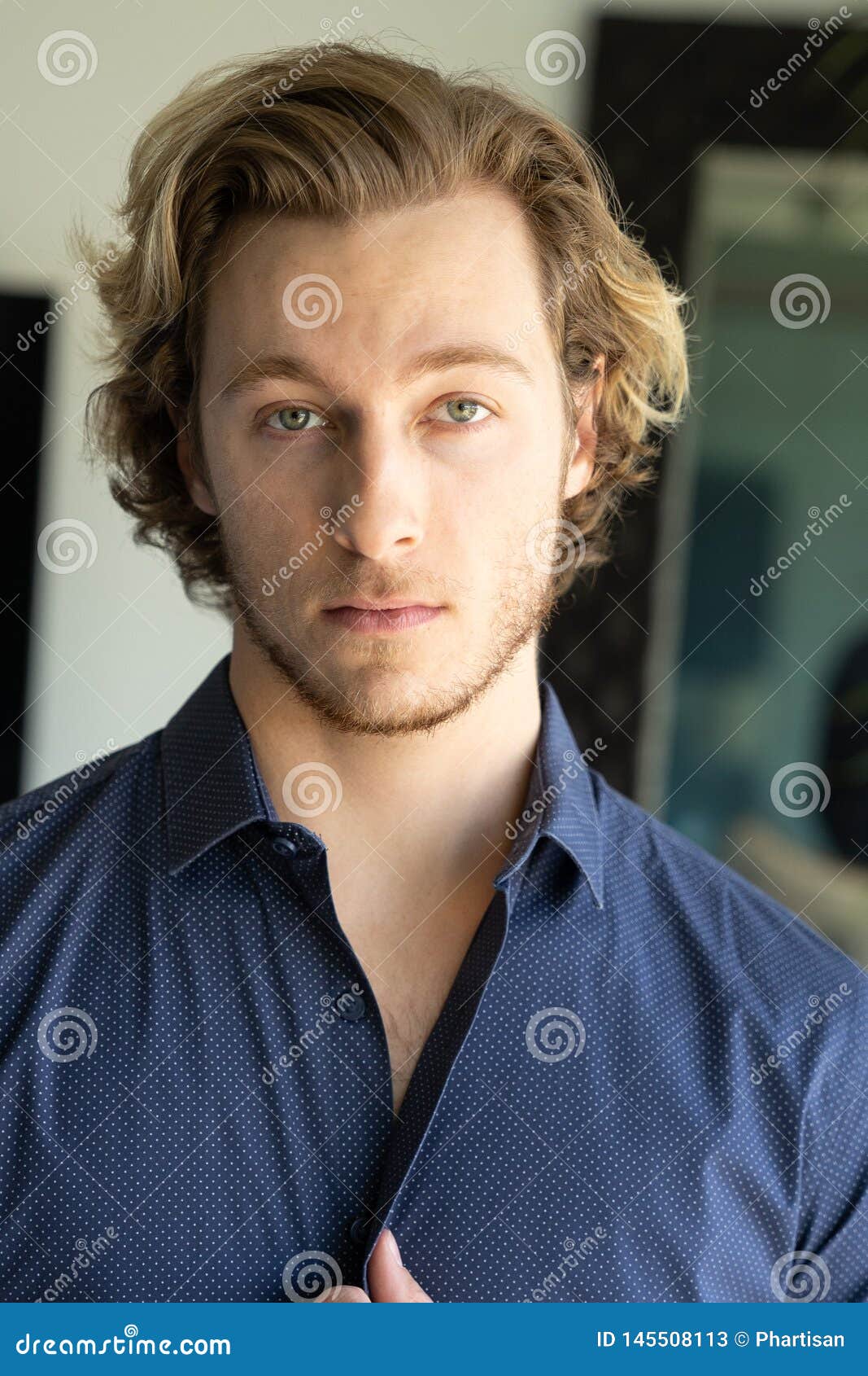 Handsome Young Man Blonde Hair And Stubble Wearing Shirt