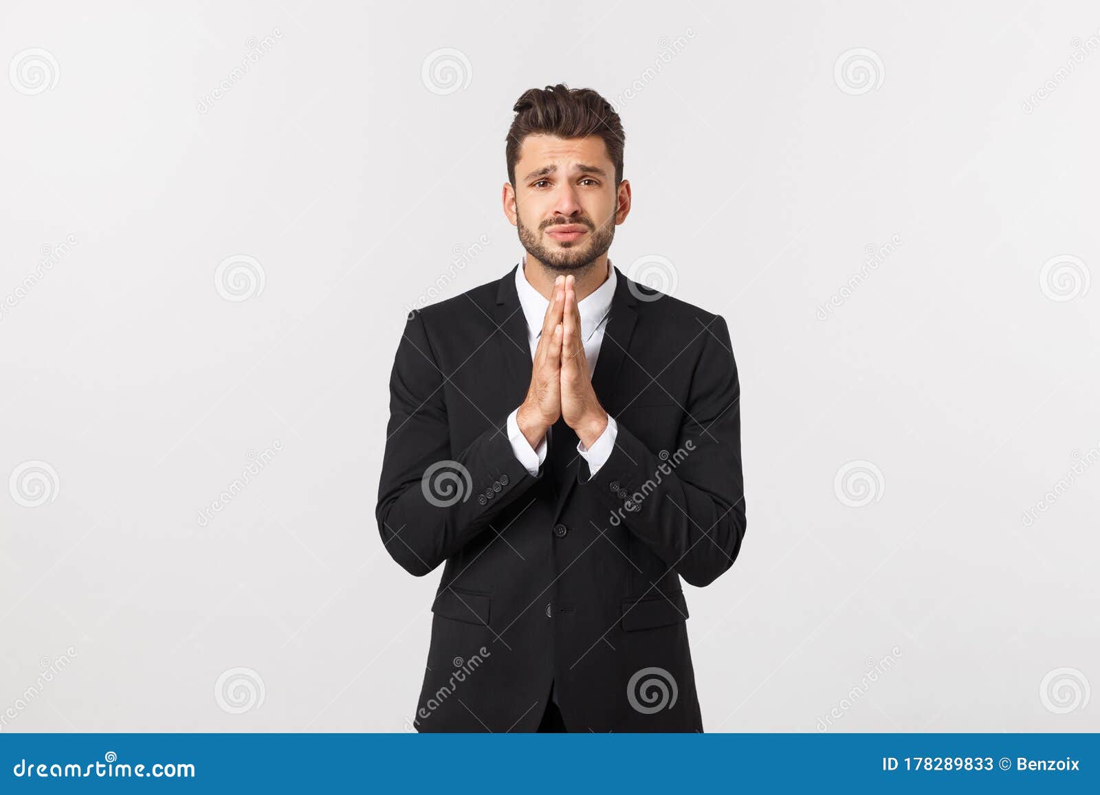 Handsome Young Business Man Standing Praying, Isolated Over White ...