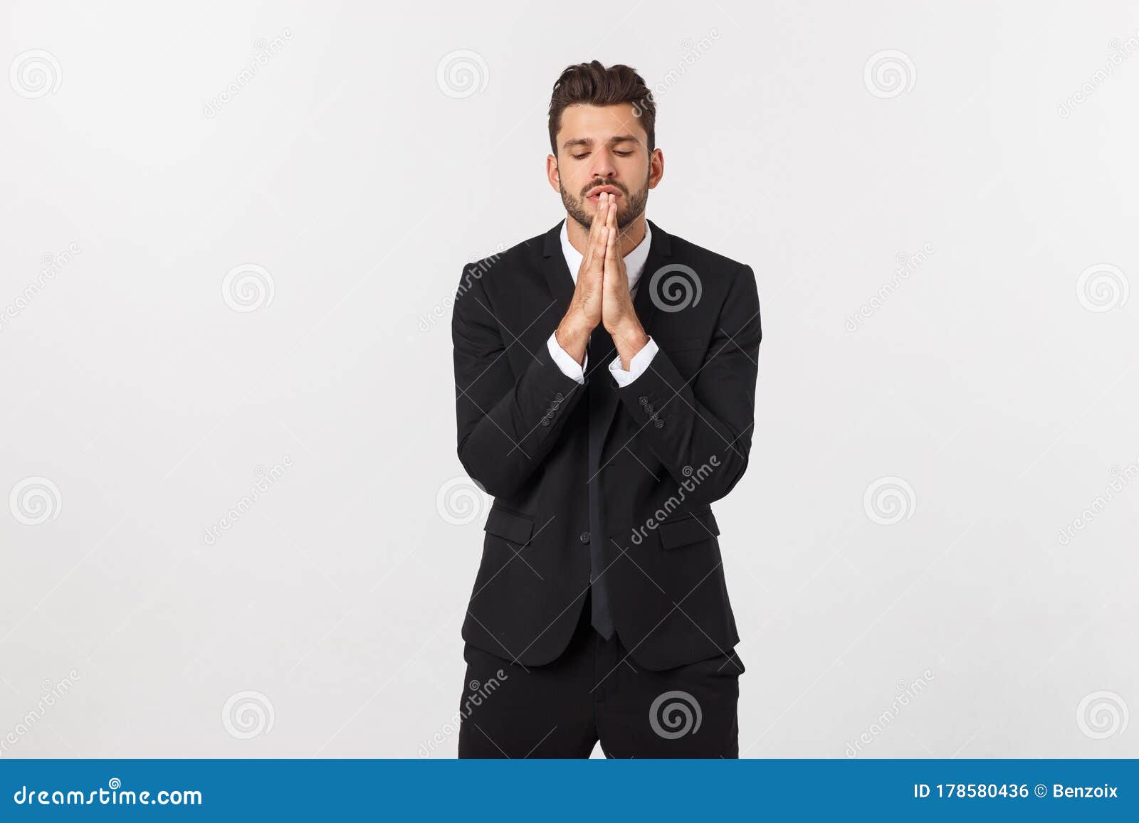 Handsome Young Business Man Standing Praying, Over White Background ...