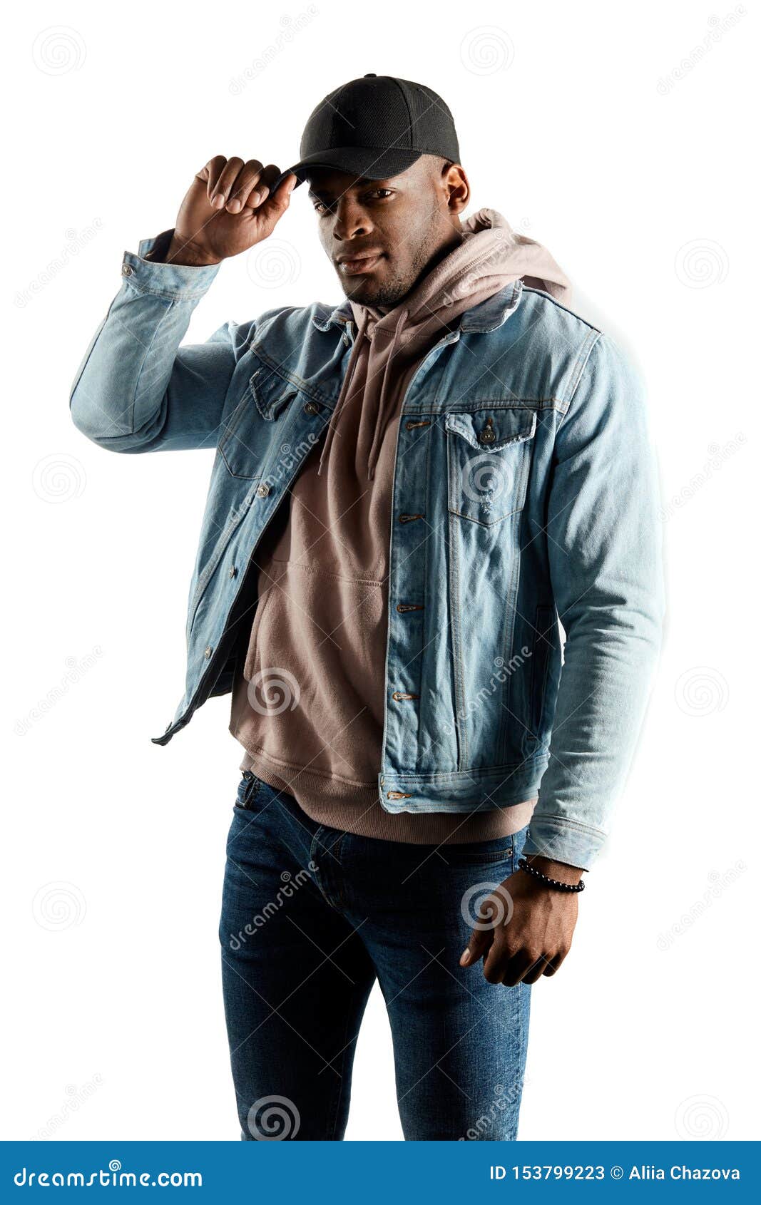 Portrait of young man in casuals posing. Male model looking down on grey  background. Royalty-Free Stock Image - Storyblocks