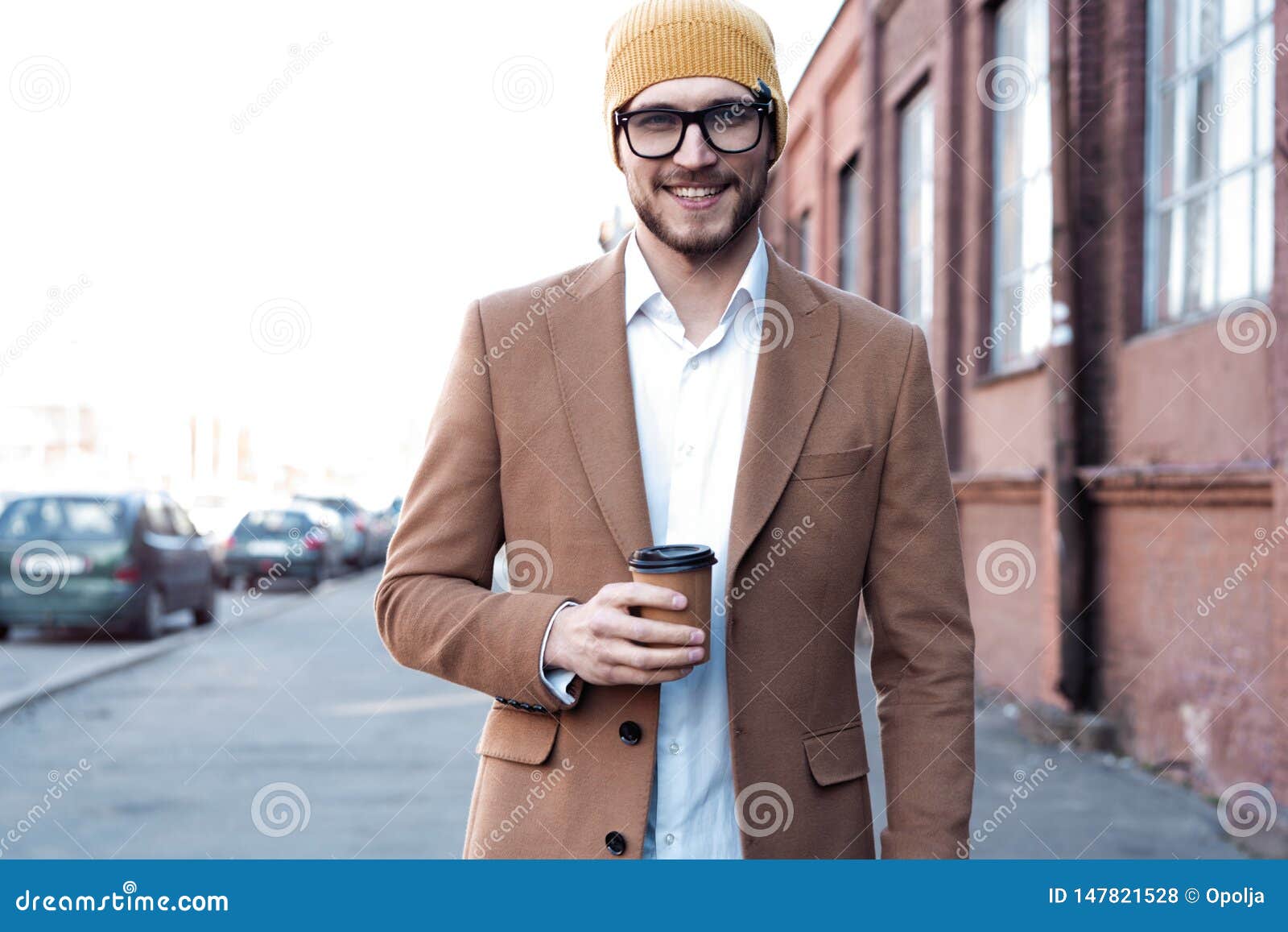 Handsome Young Man in Casual Wear Holding Disposable Cup and Smiling ...