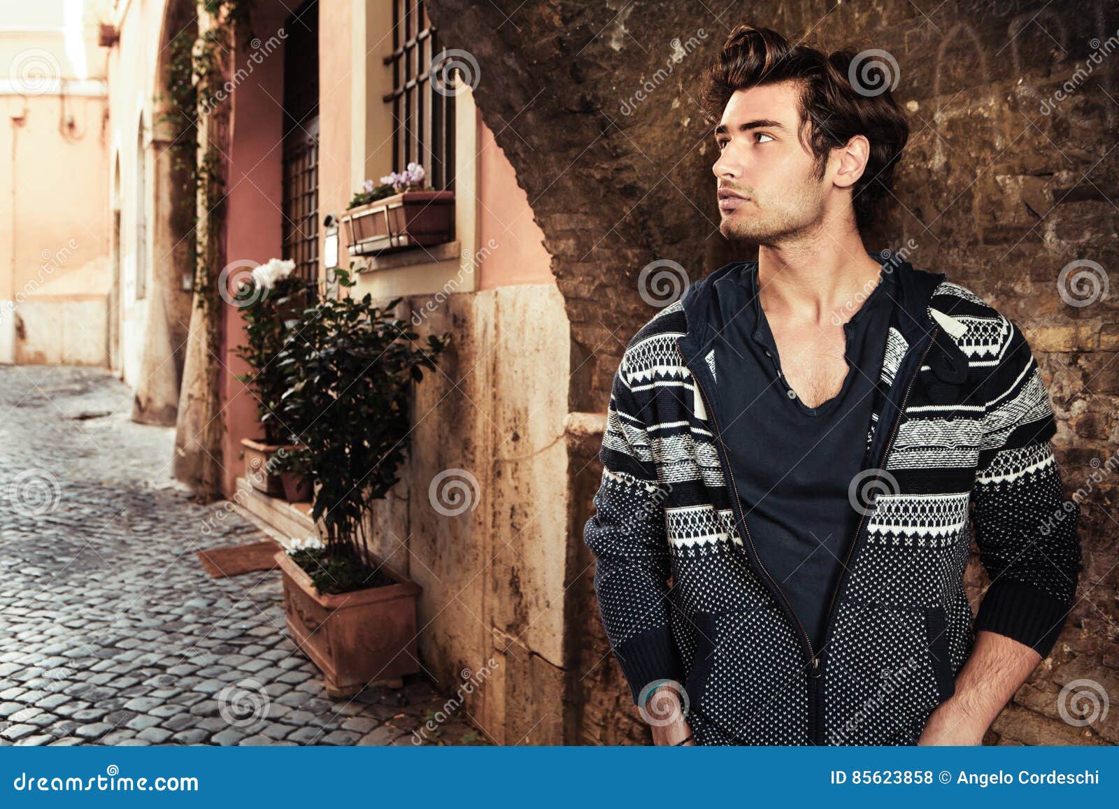 handsome young man in the city. waiting in the street.