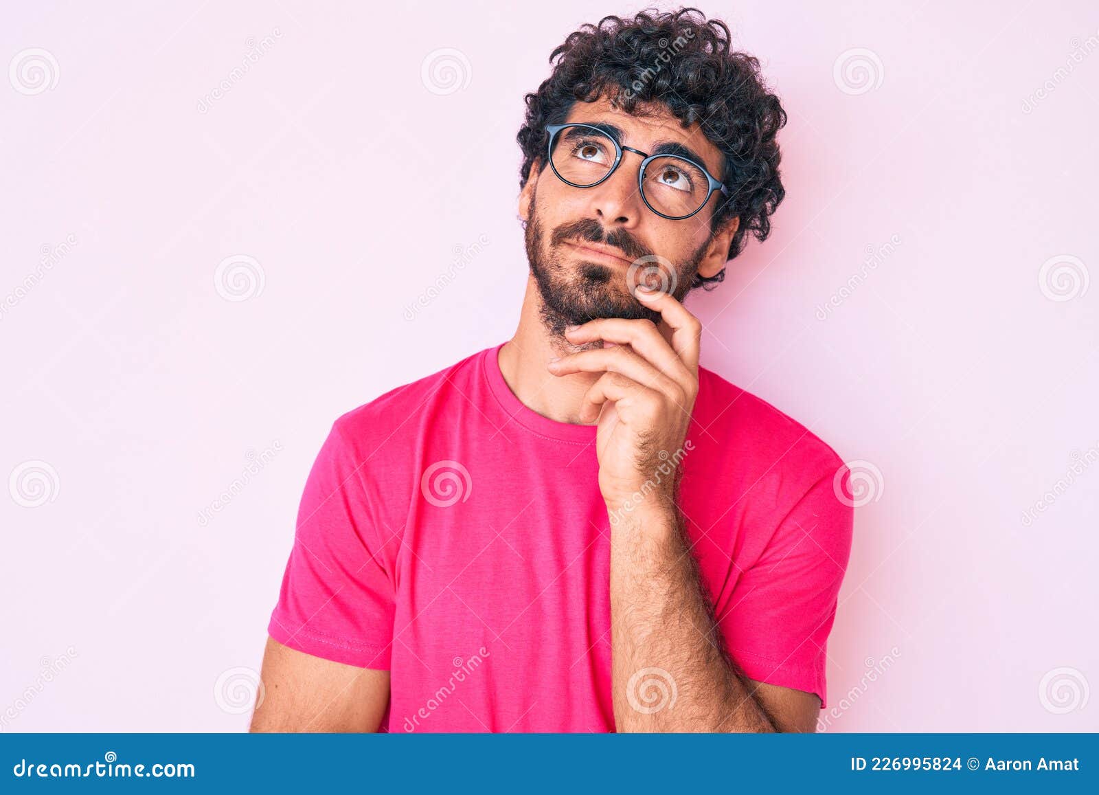 Handsome Young Man with Curly Hair and Bear Wearing Casual Clothes and  Glasses Serious Face Thinking about Question with Hand on Stock Photo -  Image of think, chin: 226995824