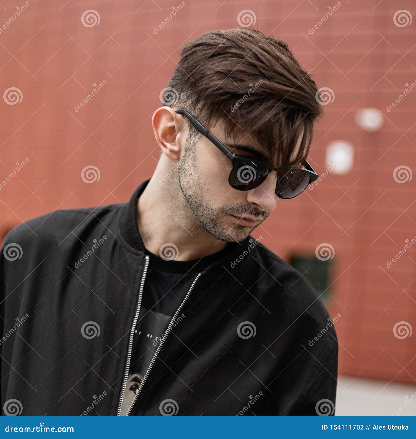 Handsome Young Man Hipster with a Fashionable Hairstyle in Stylish Sunglasses in a Black Trendy Jacket in the City Stock Photo - Image of adult, american: 154111702 Handsome Young Man Hipster with a Fashionable Hairstyle in Stylish Sunglasses in a Black Trendy Jacket in the City Stock Photo - Image of adult, american: 154111702