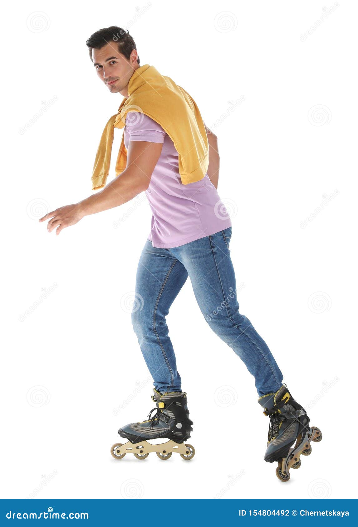 Handsome Young Man With Inline Roller Skates On Background Stock Photo