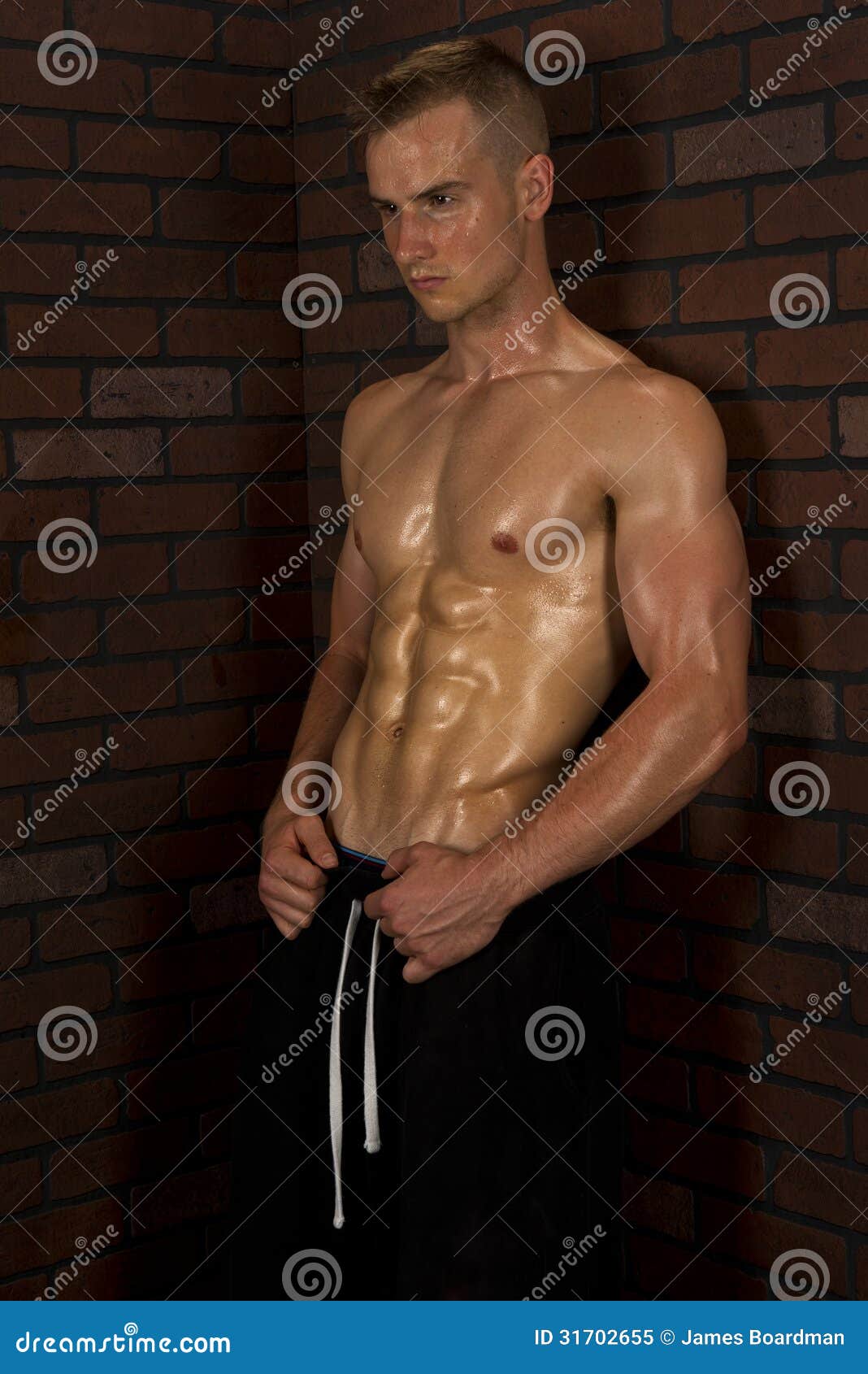 Funny overweight nerd flexing muscle Stock Photo 