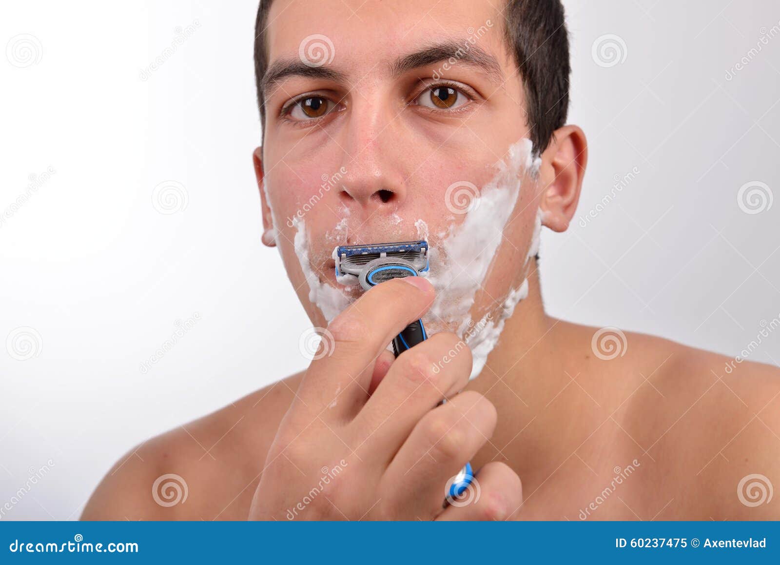 Handsome Young Man with Lots of Shaving Cream on His Face is Sha Stock