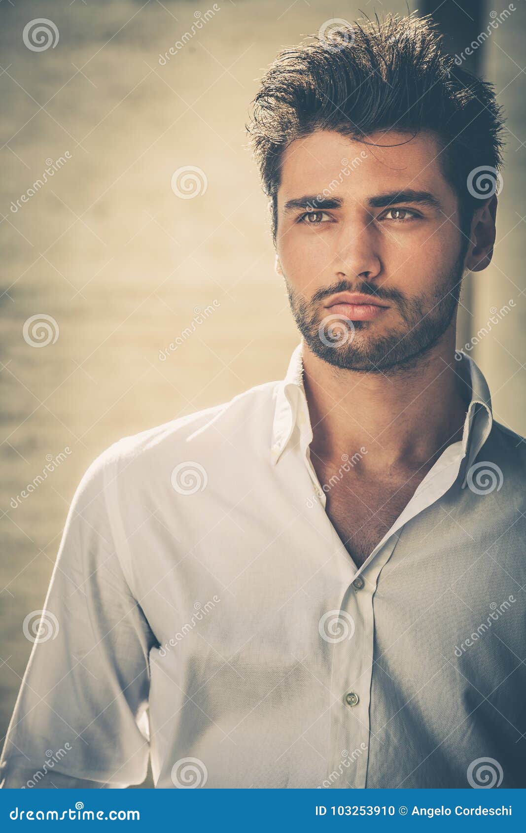 handsome young man portrait. intense look and eye-catching beauty