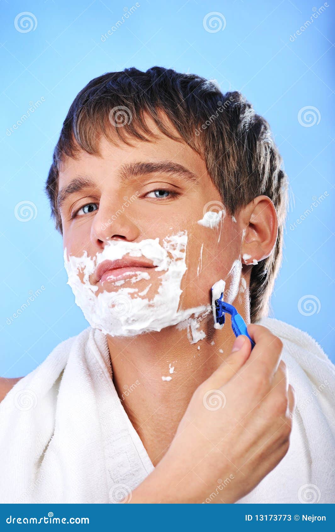 Handsome young man shaving stock image. Image of portrait 13173773