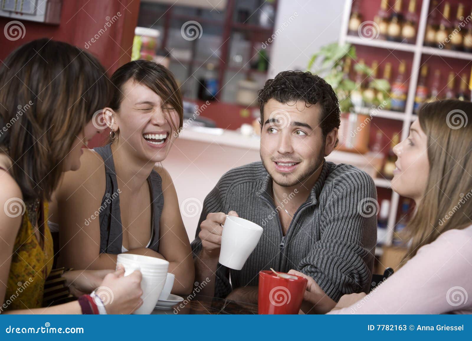 handsome young man surrounded by women