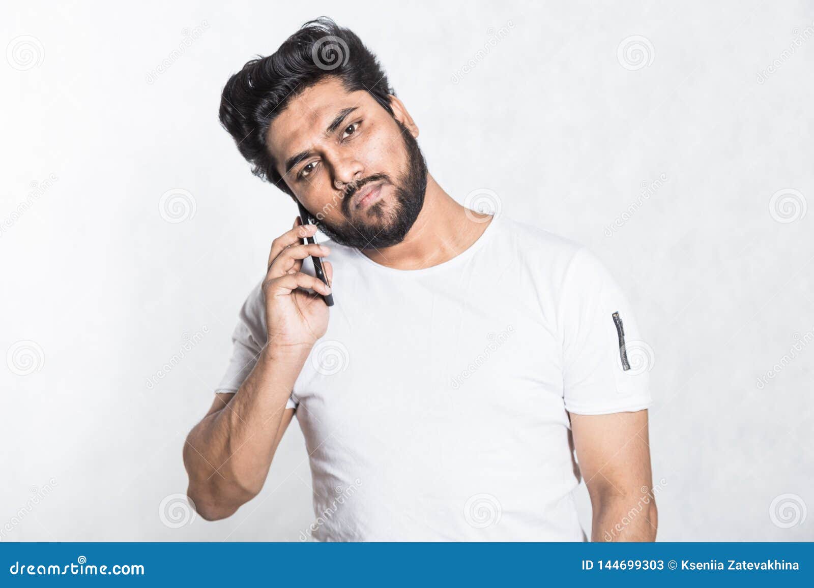 Handsome Young Man Talking on His Smartphone. Stock Image - Image of ...