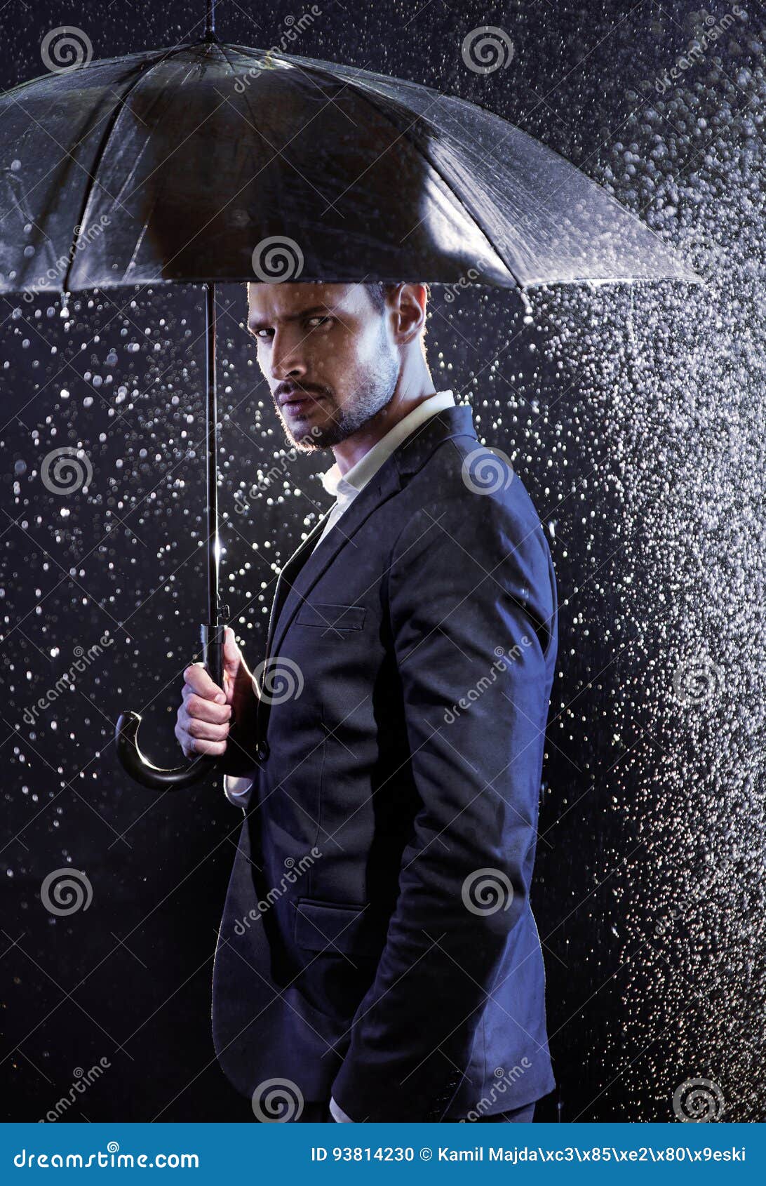 Handsome Young Man with an Umbrella Stock Photo Image of night