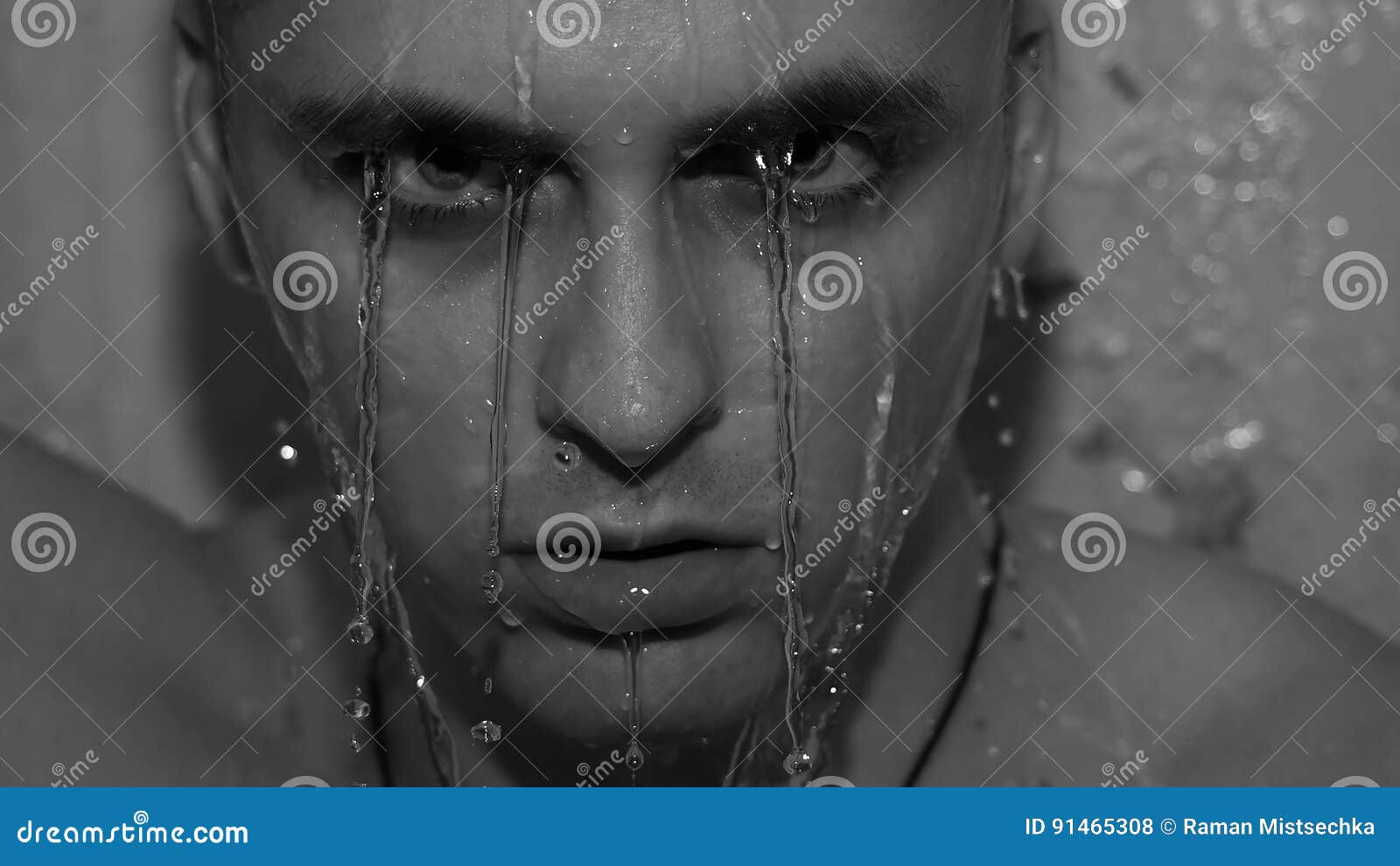 A Handsome Young Man Under the Shower Dripping Wet Stock Photo Image