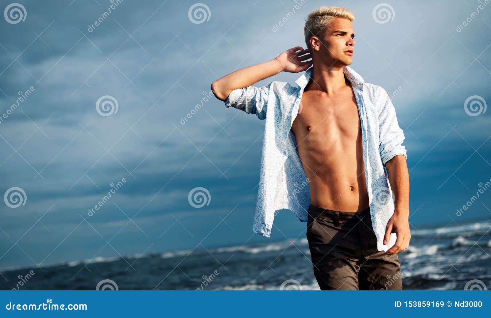 Handsome Man Standing at Sea Beach while on Vacation Stock Image ...