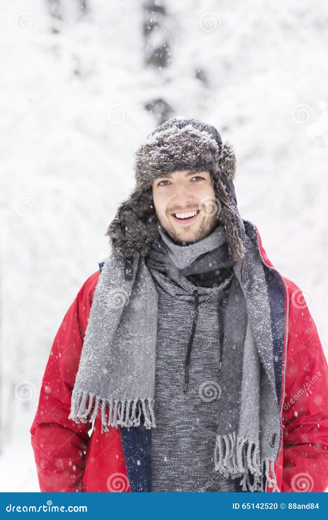 Handsome Young Smiling Man in Winter Forest. Snowing Day Stock Photo ...