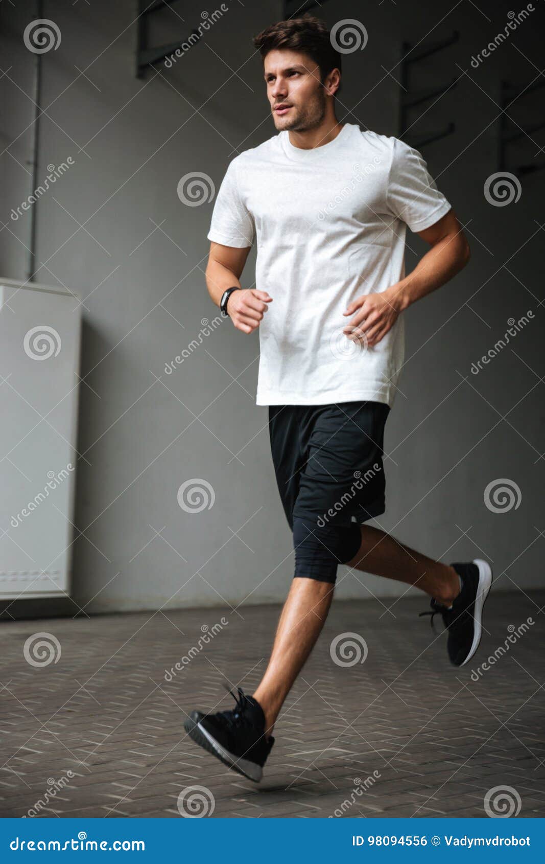 Handsome Young Sports Man Running at the Stadium Stock Photo Image of