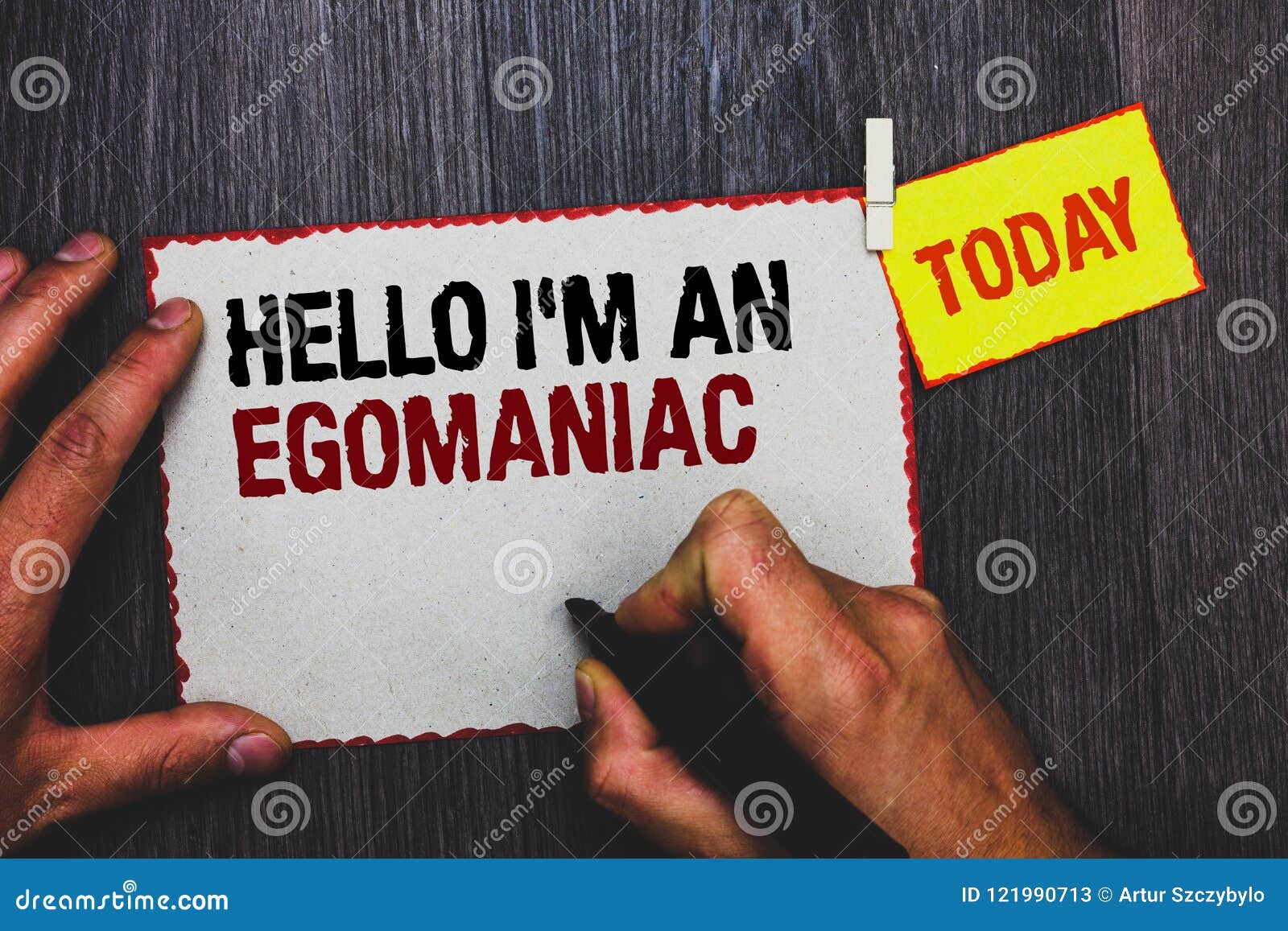 handwriting text writing hello i am an egomaniac. concept meaning selfish egocentric narcissist self-centered ego hand grip black