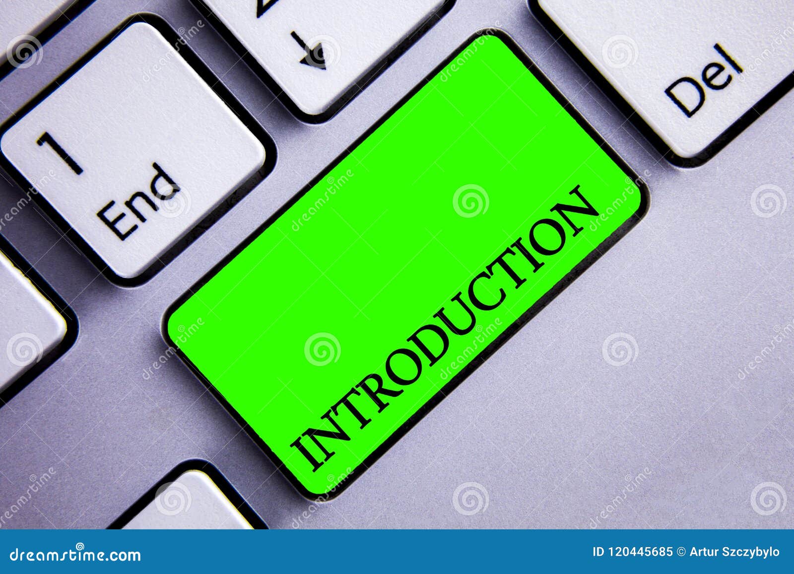 handwriting text writing introduction. concept meaning first part of a document formal presentation to an audience keyboard green