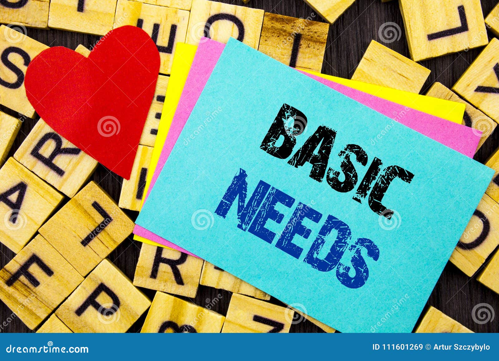 handwritten text showing basic needs. conceptual photo health in developing countries essential food lack written on colorful stic