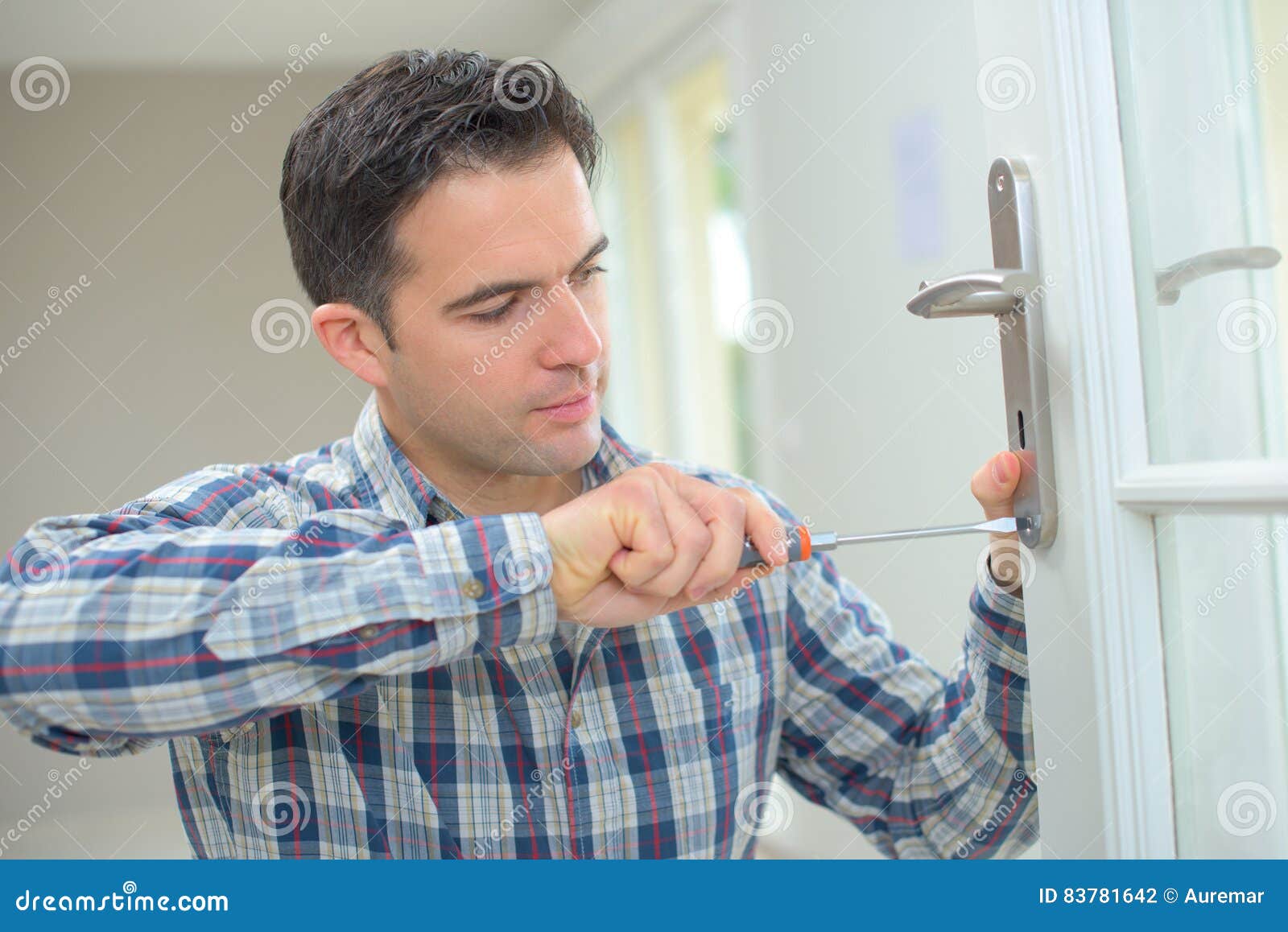 Handyman fitting new door stock photo. Image of montage 83781642