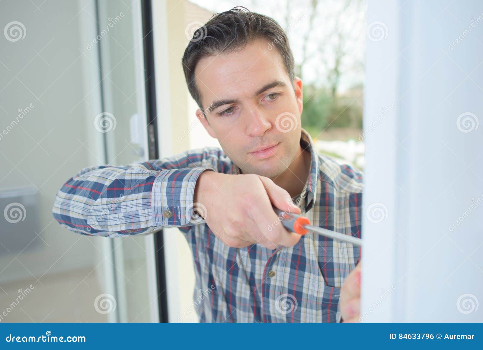 Handyman fitting new door stock photo. Image of hole 84633796