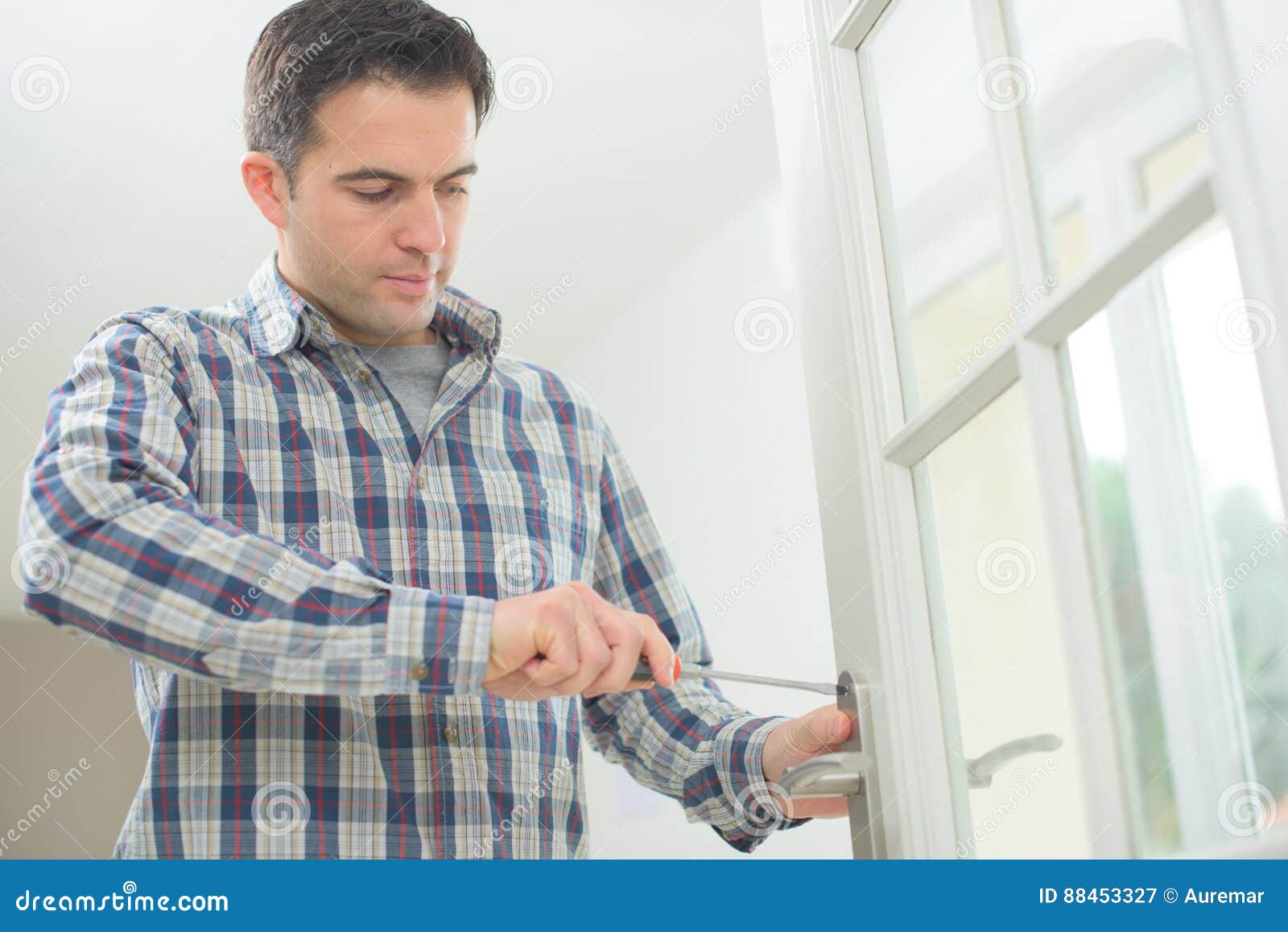 Handyman fitting new door stock image. Image of apartment 88453327