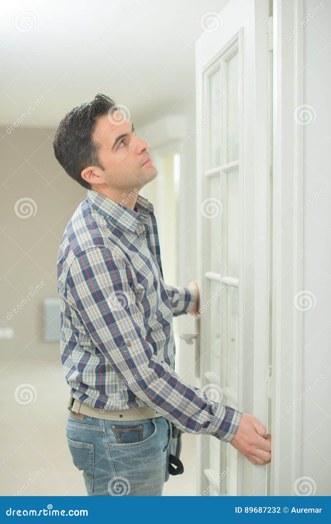 Handyman fitting new door stock photo. Image of master 89687232