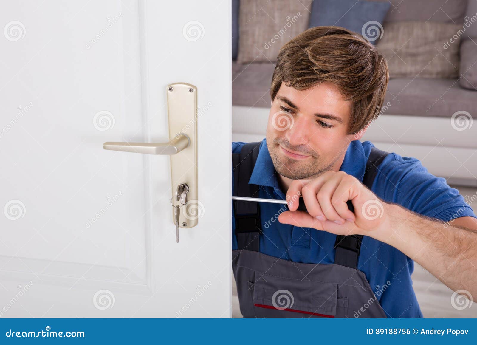 Handyman Fitting a New Door Stock Photo Image of holding, lock 89188756