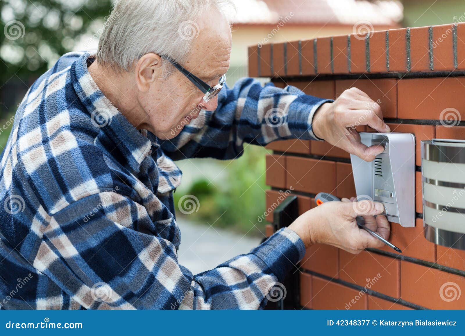 handyman fixing intercom