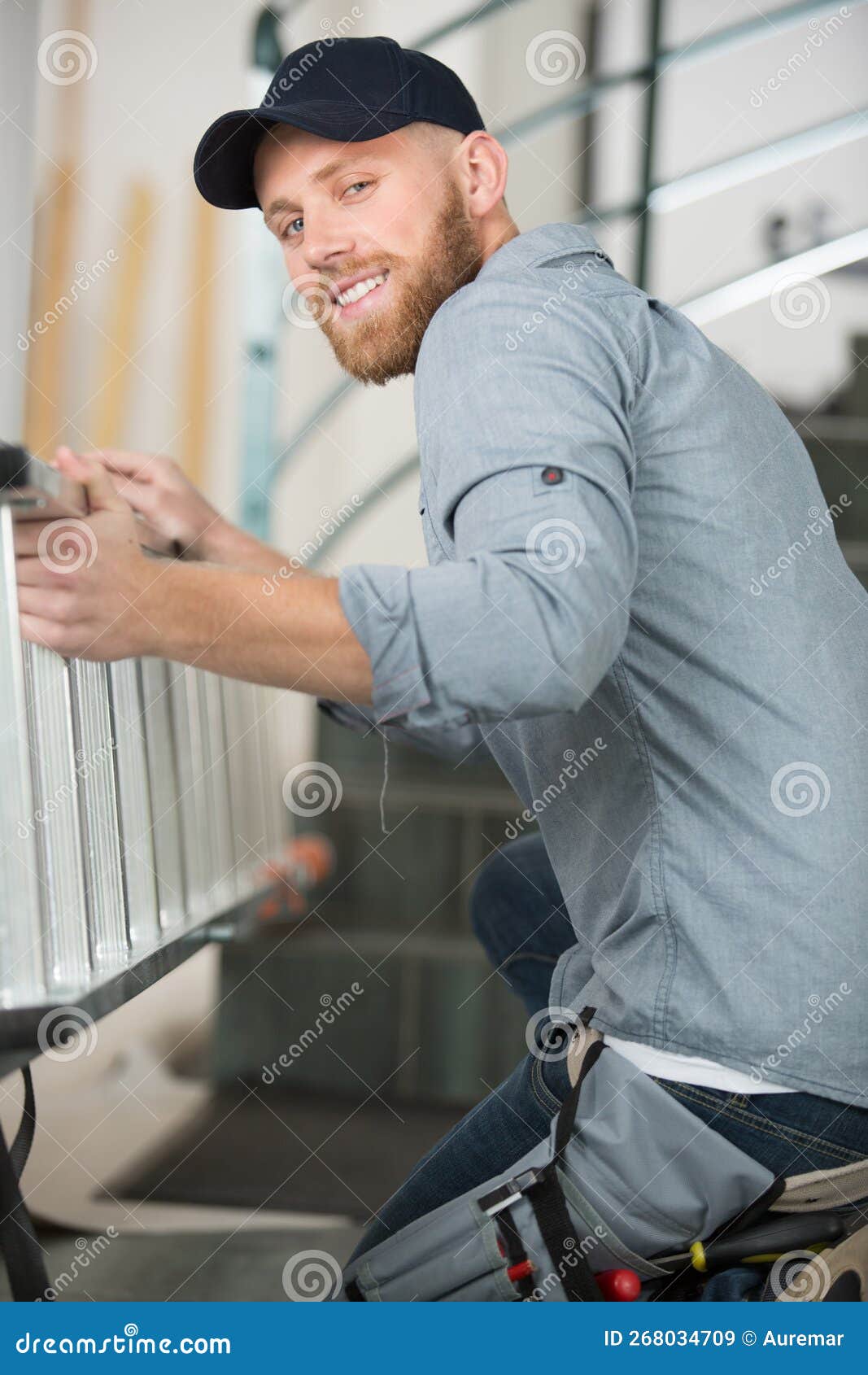 Handyman holding a ladder stock image. Image of builder 268034709