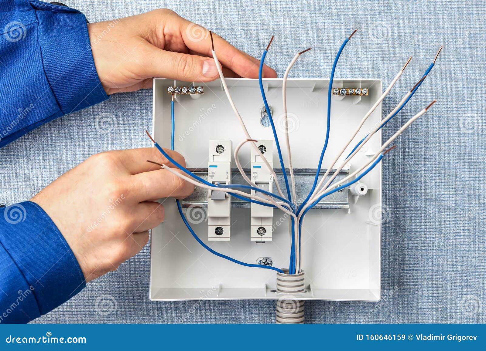 handyman installs circuit breakers for home wiring