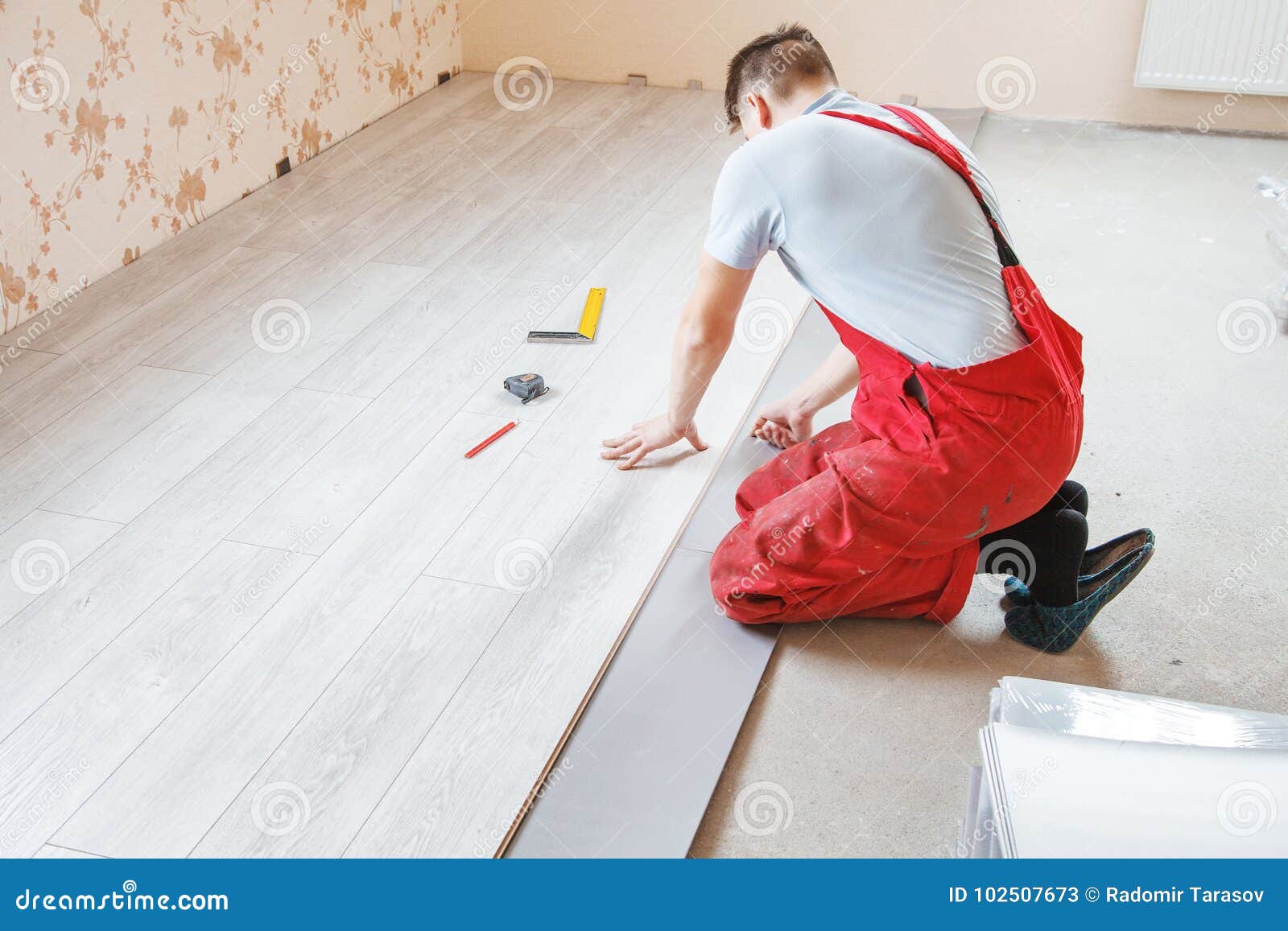 Handyman Laying Down Laminate Flooring Boards Stock Image Image