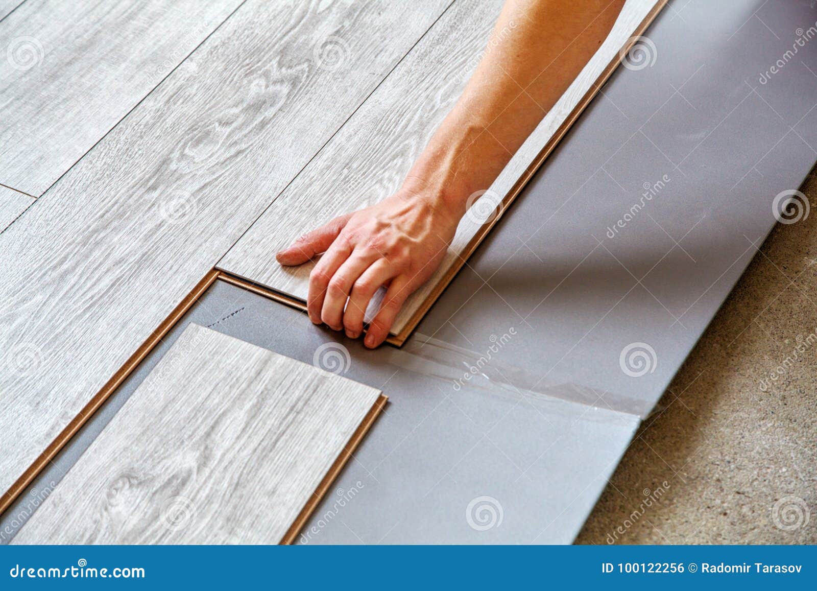 Handyman S Hands Laying Down Laminate Flooring Boards Stock Photo