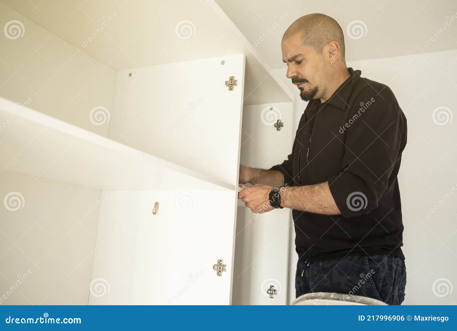 Handyman Man Assembling a Closet Stock Photo Image of adult, employee 217996906