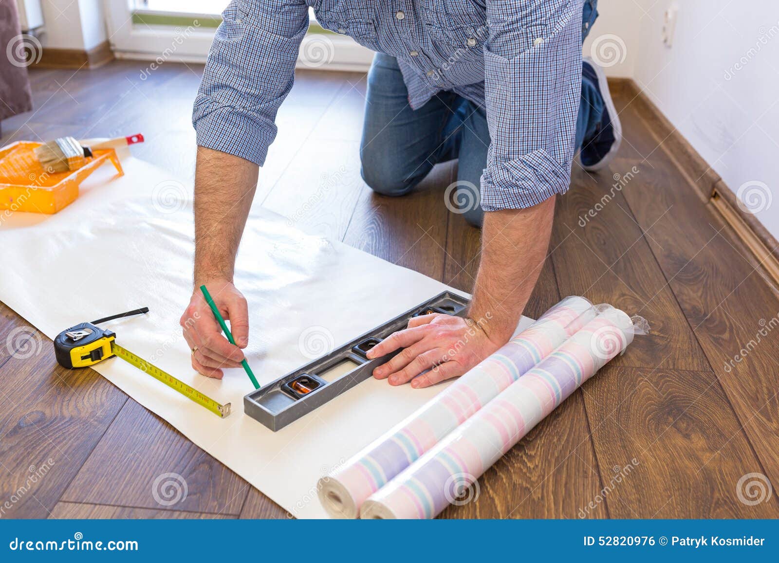 Handyman Measuring Wallpaper To Cut Stock Photo Image HD Wallpapers Download Free Images Wallpaper [wallpaper981.blogspot.com]