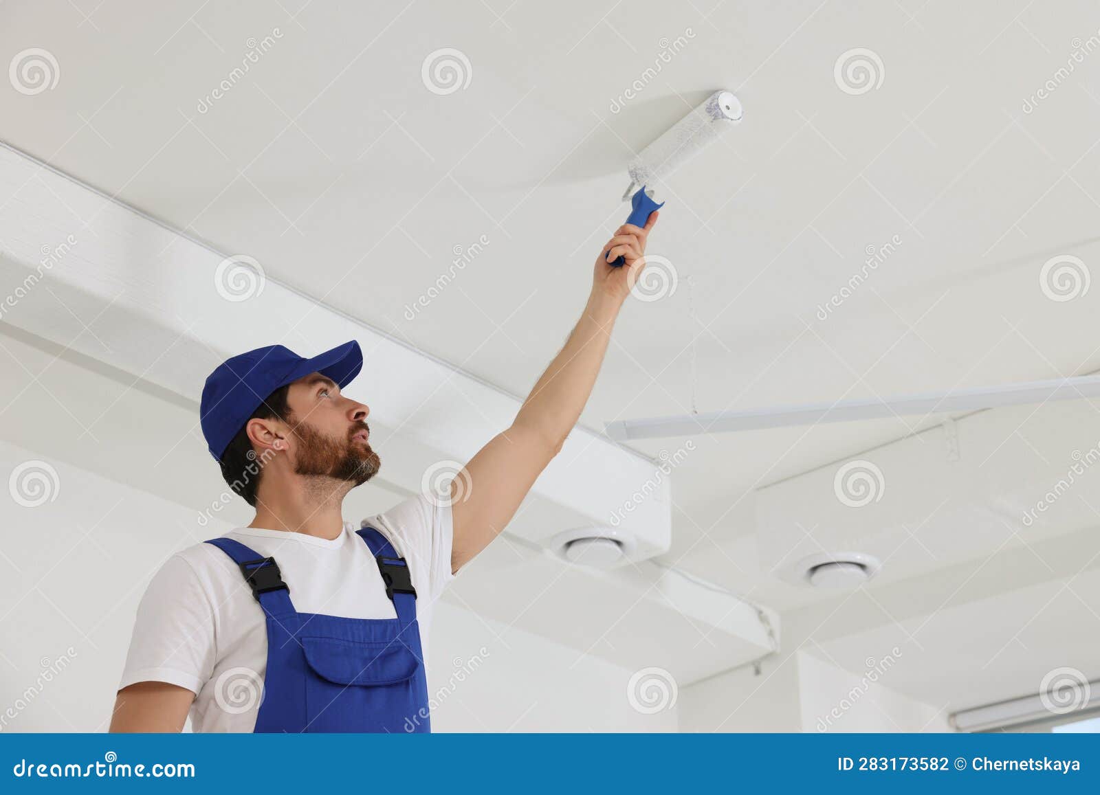 Handyman Painting Ceiling with Roller in Room Stock Photo Image of